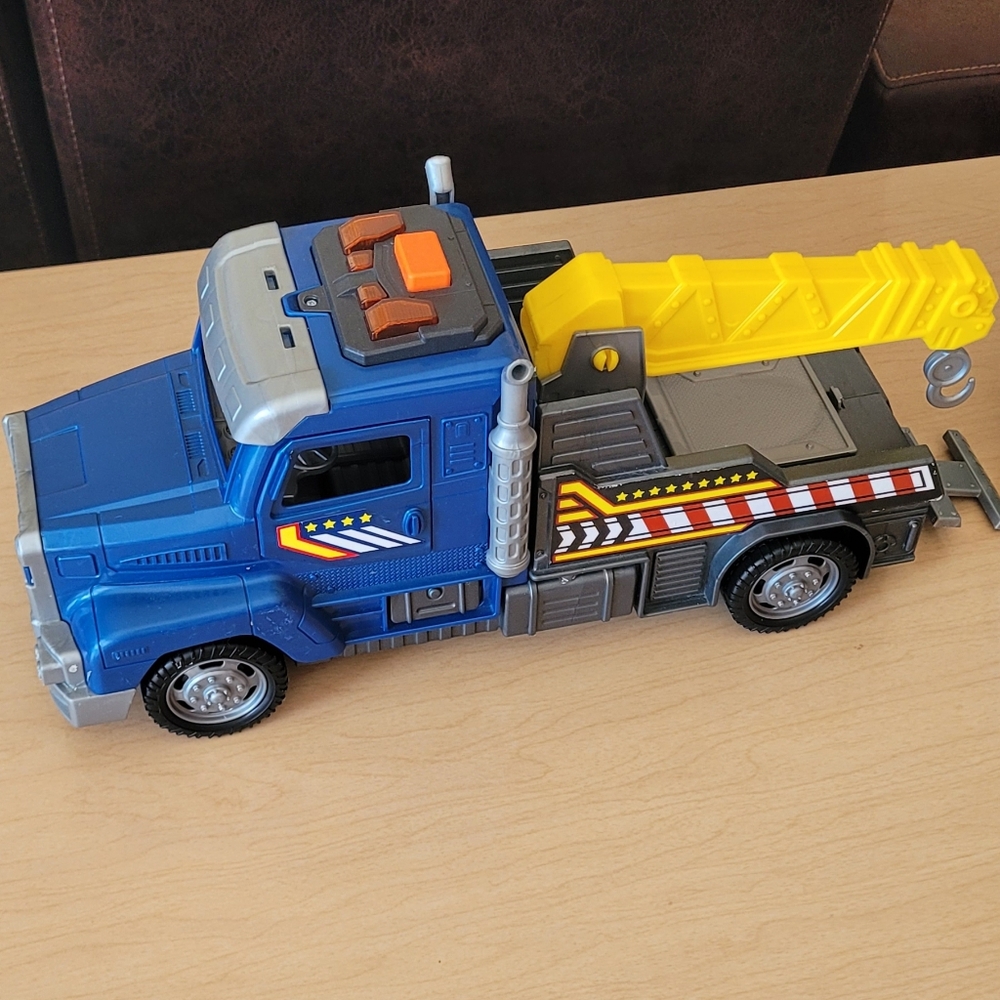 Blue and Yellow Toy Tow Truck